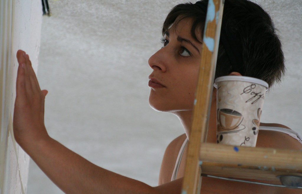 volunteer closely looking at detail