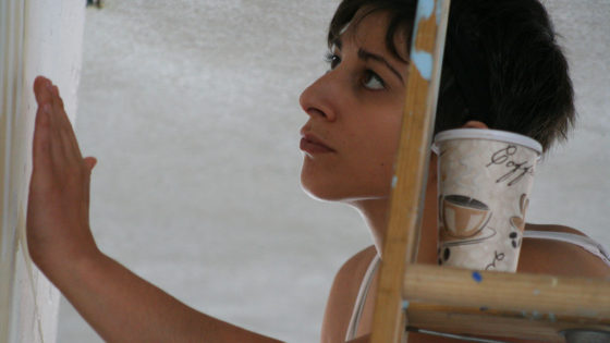 volunteer closely looking at detail