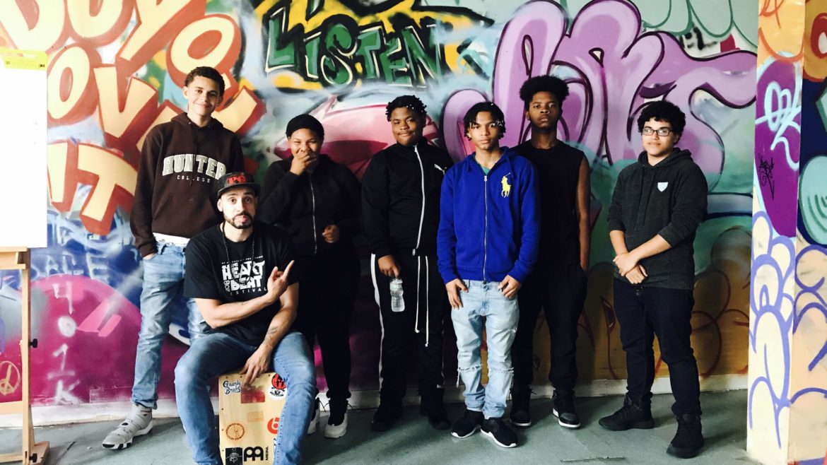 summer program students in front of mural
