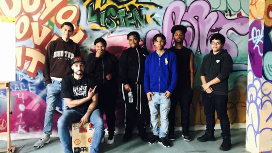 summer program students in front of mural
