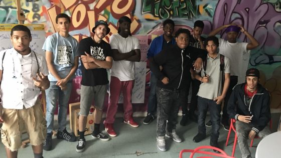 summer program students in front of mural