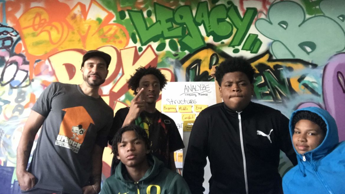 summer program students in front of mural