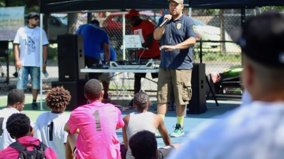 Coach Damian talking to players