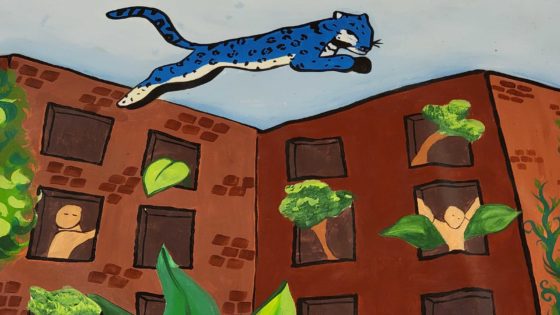 A jaguar leaps around the housing projects by the school